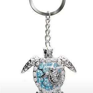 Silver toned opal sea turtle keychain